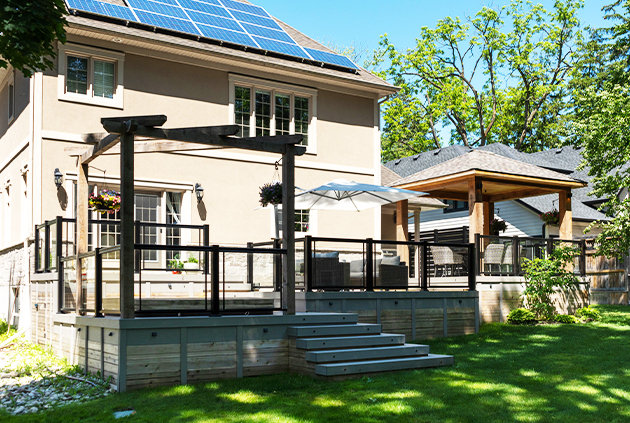 Composite deck project with a pergola, pavilion, and custom deck accessories